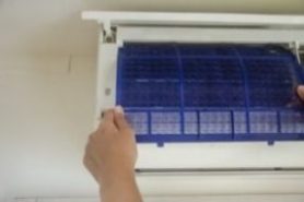Cleaning A/C filter.